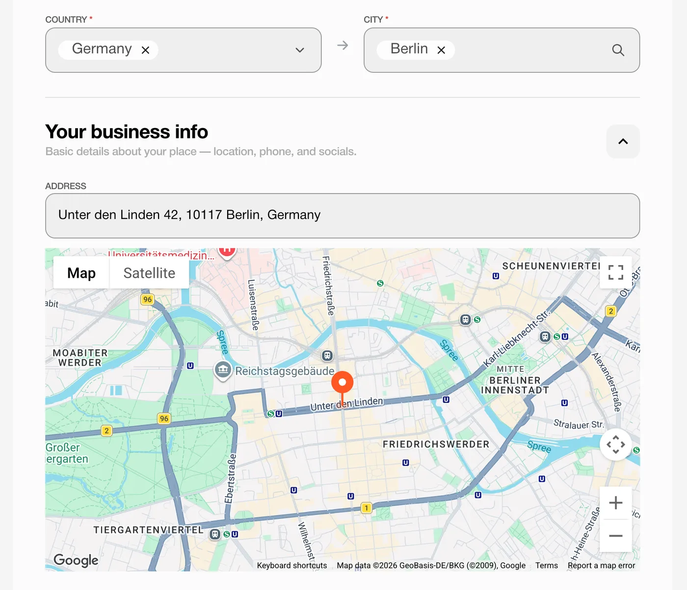 Location block: country and city selectors, street address field and a Google map with a draggable pin on the business entrance